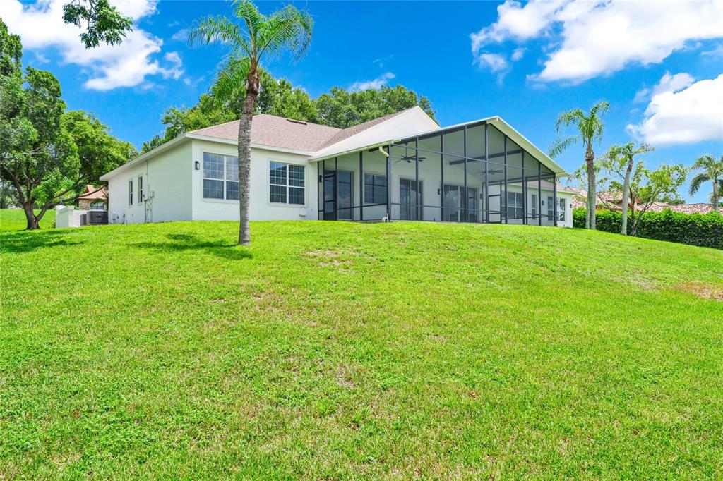 1703 Roberts Landing Road Windermere, FL 34786 - Photo 54 of 61 a view of a house next to a big yard and large trees