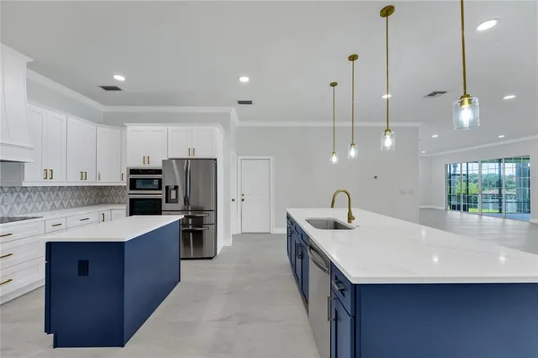 a view of kitchen and hall with a large window