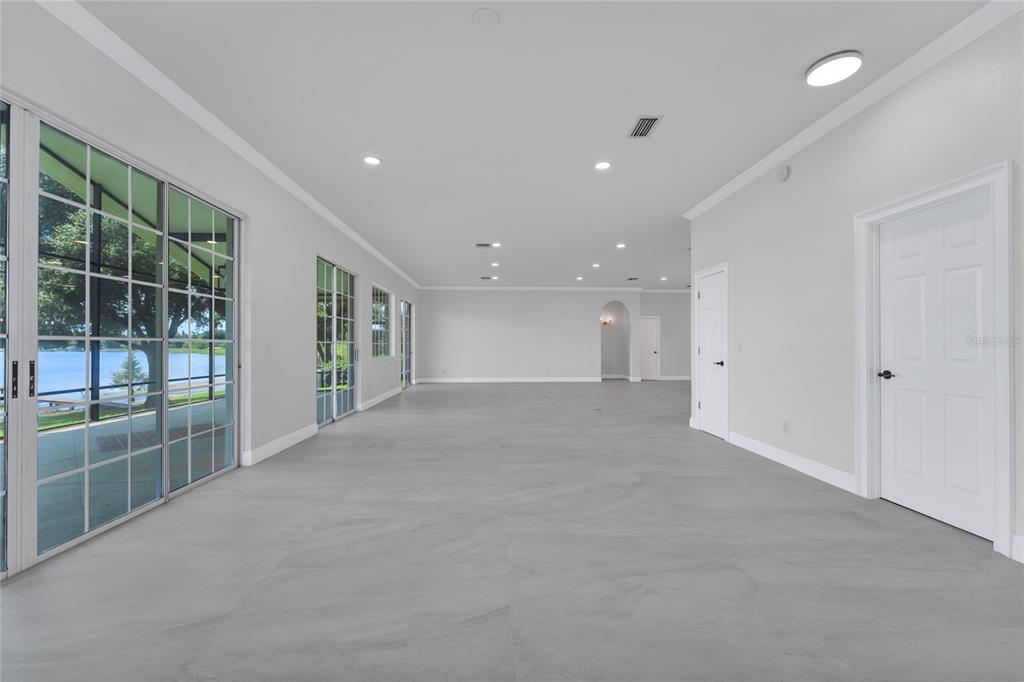 1703 Roberts Landing Road Windermere, FL 34786 - Photo 10 of 61 a view of an empty room with glass door and balcony
