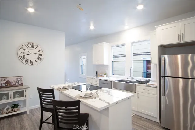 a living room with furniture potted plant and a window