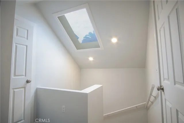 a bedroom with a bed and walk in closet