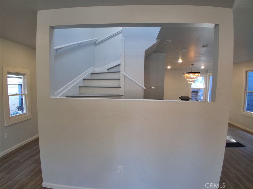 3520 Harrison Street Oakland, CA 94611 - Photo 2 of 24 a view of a hallway with wooden floor and staircase