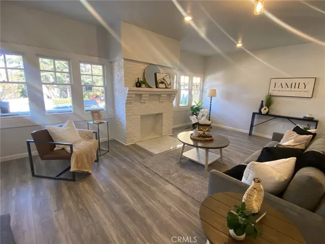a living room with furniture or couch and a potted plant