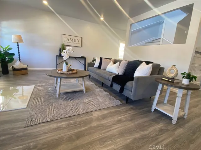 a living room with furniture and a rug
