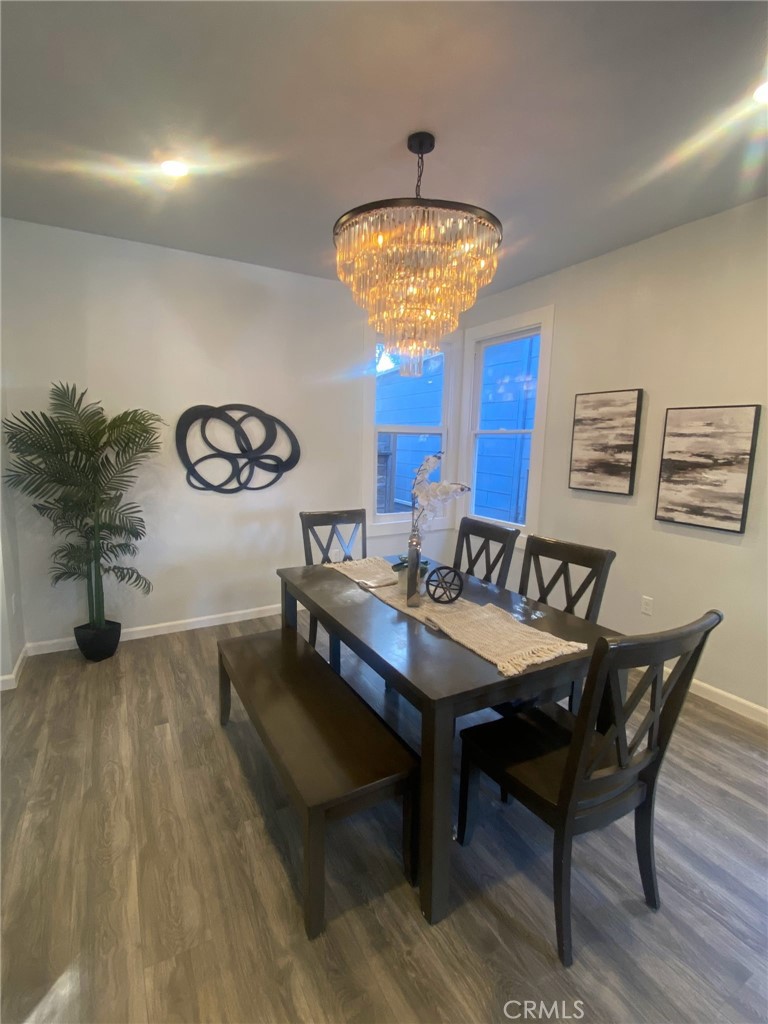 3520 Harrison Street Oakland, CA 94611 - Photo 7 of 24 a view of a dining room with furniture and chandelier