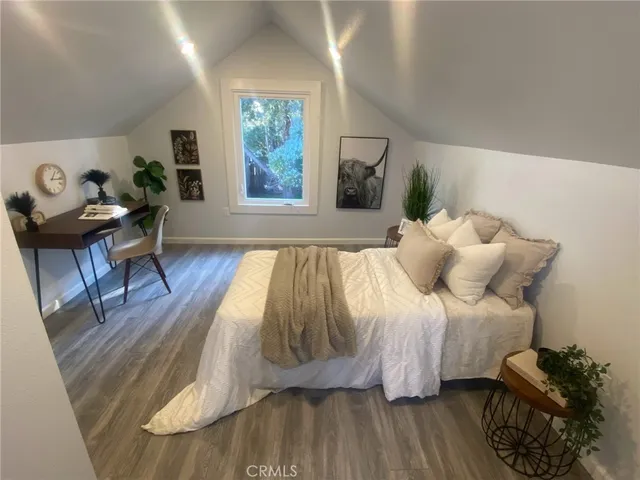 a bed room with a bed and a window