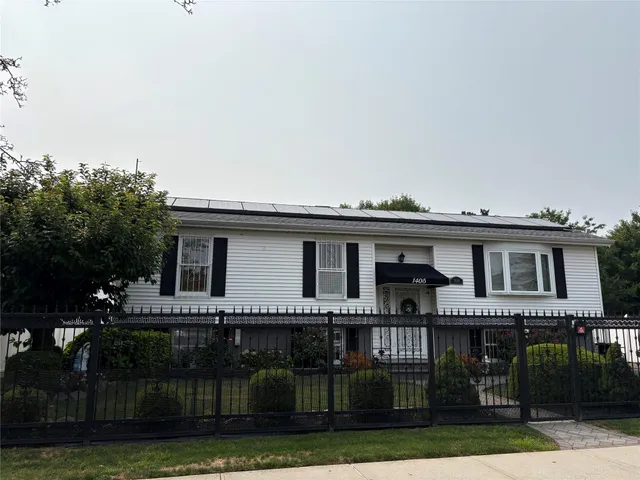 a house that has tree in front of it