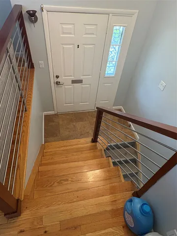a view of staircase with white walls