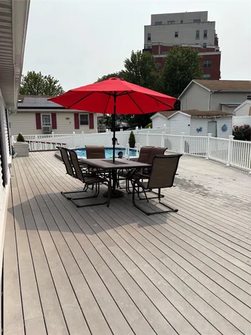 an outdoor space with furniture and umbrella