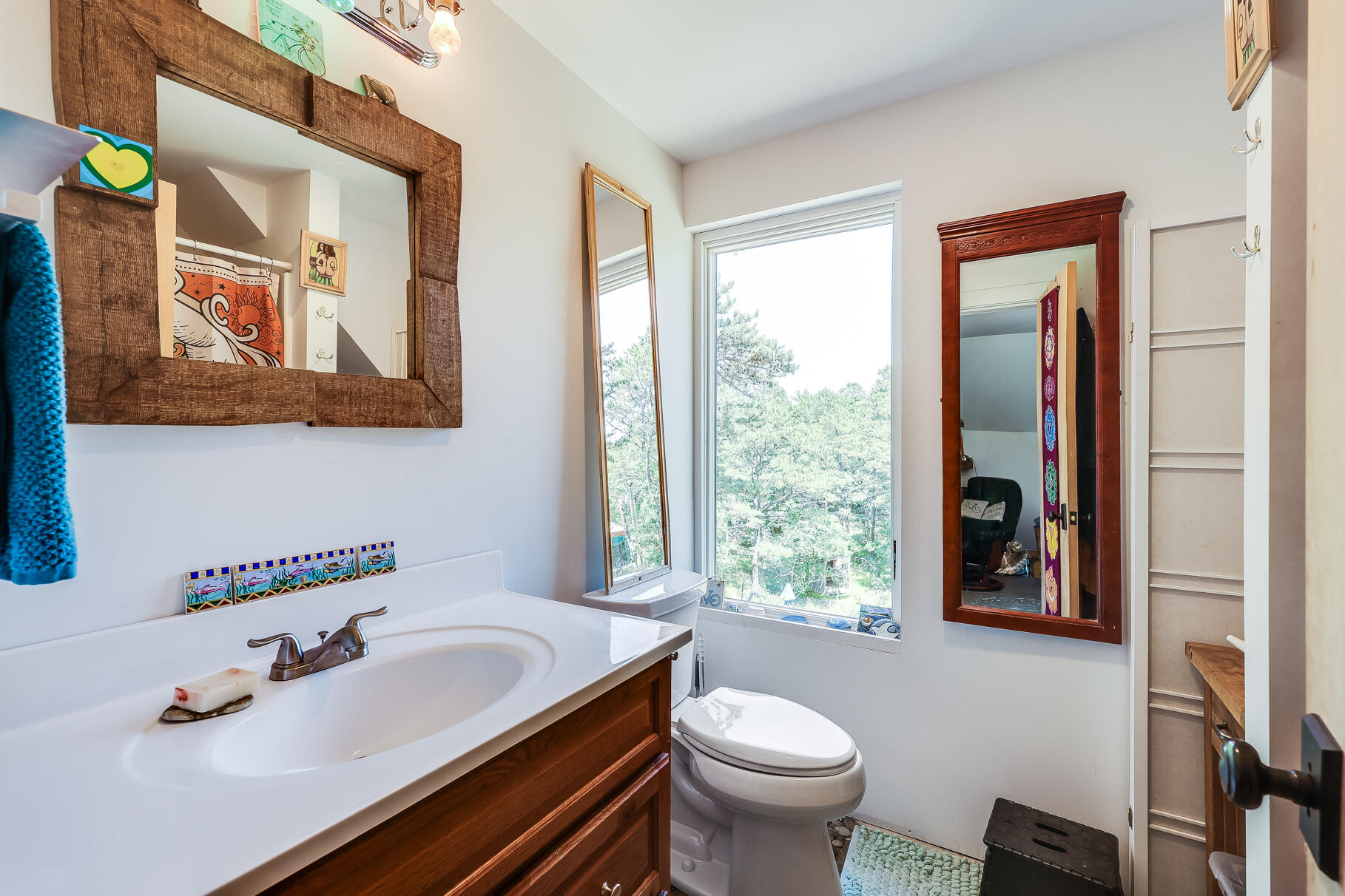 23 Old Bridge Road Truro, MA 02666 - Photo 21 of 44 a bathroom with a sink and a mirror