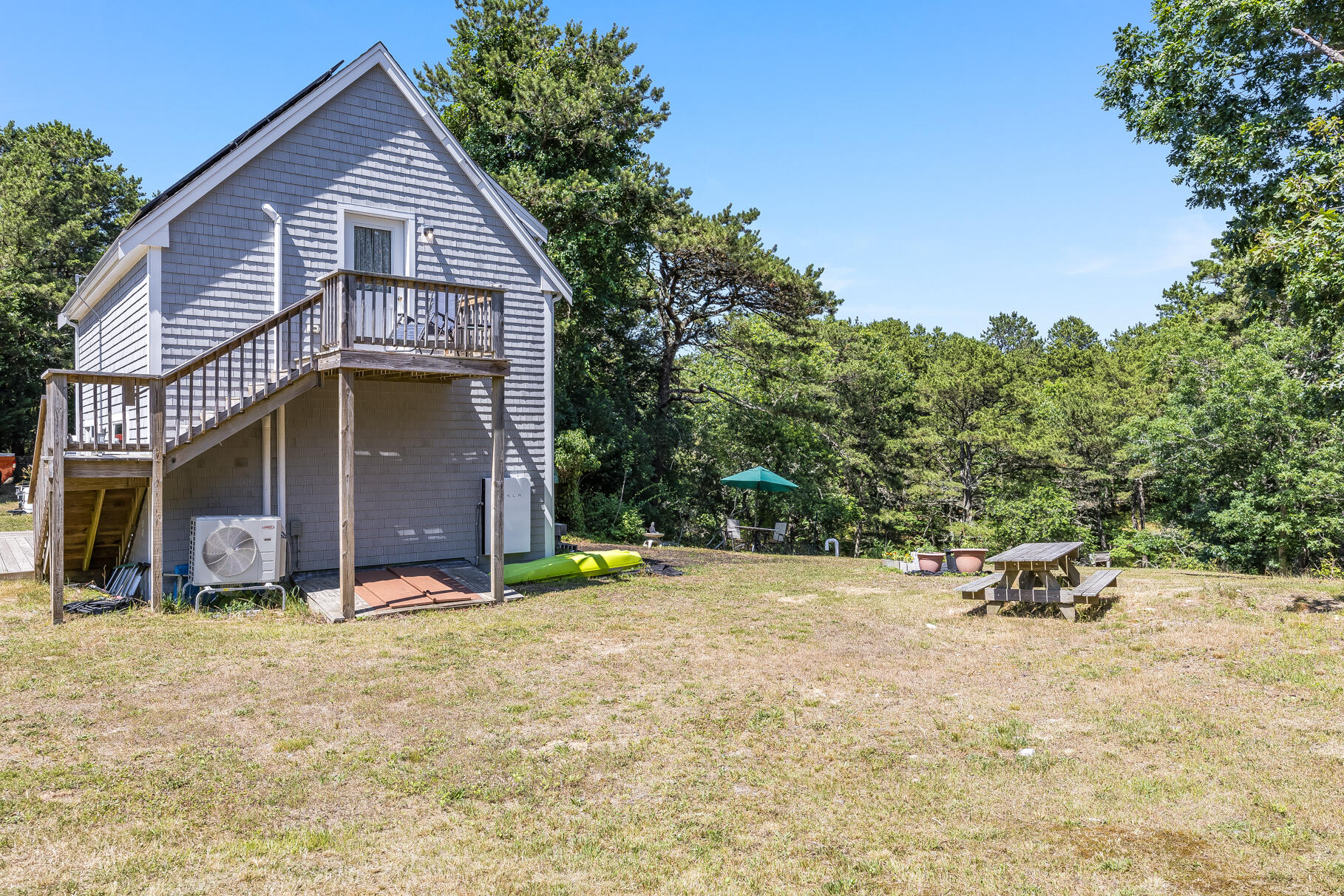 23 Old Bridge Road Truro, MA 02666 - Photo 32 of 44 a view of a house with a yard and sitting area