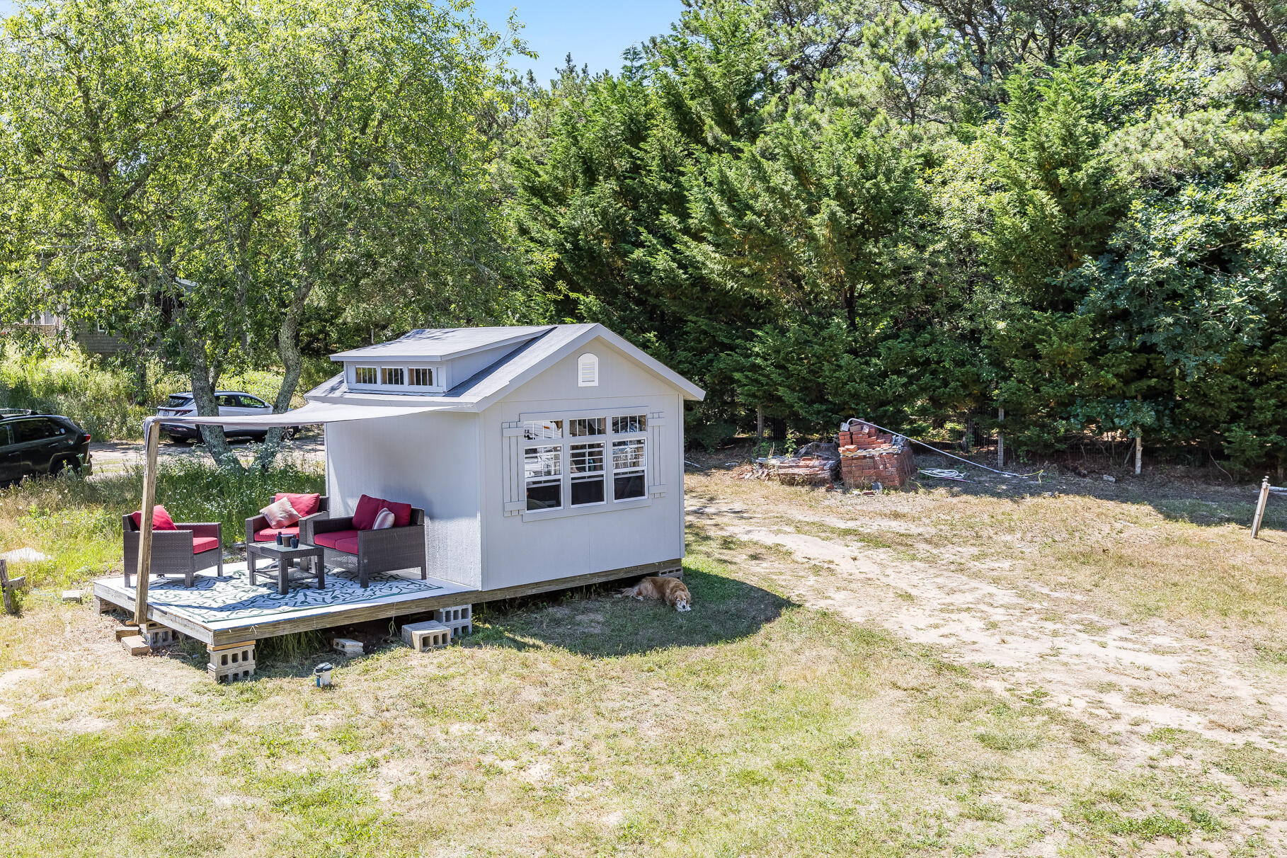23 Old Bridge Road Truro, MA 02666 - Photo 35 of 44 a view of small house with yard and sitting area