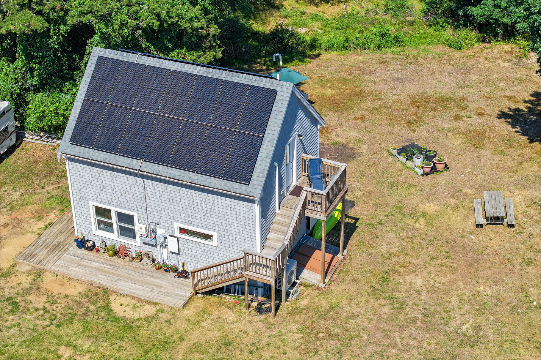 23 Old Bridge Road Truro, MA 02666 - Photo 39 of 44 a aerial view of a house with backyard and deck