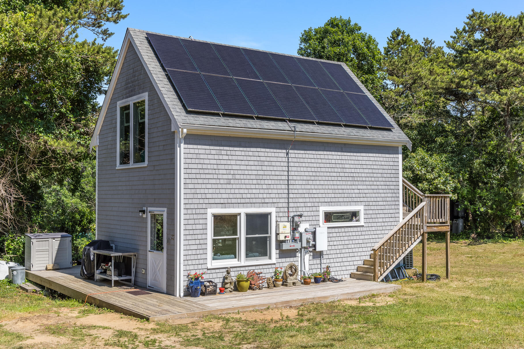 23 Old Bridge Road Truro, MA 02666 - Photo 4 of 44 a view of a house with a yard patio and swimming pool