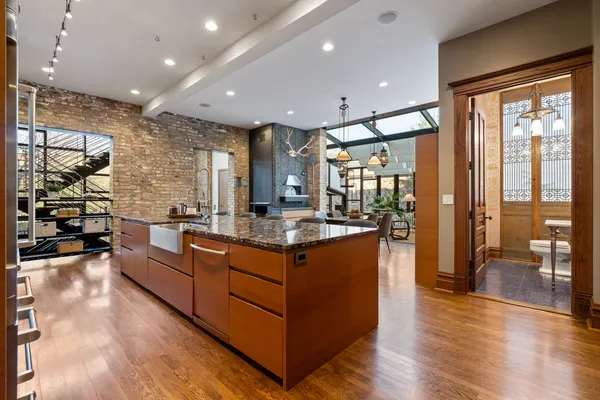 a living room with furniture a flat screen tv and a floor to ceiling window