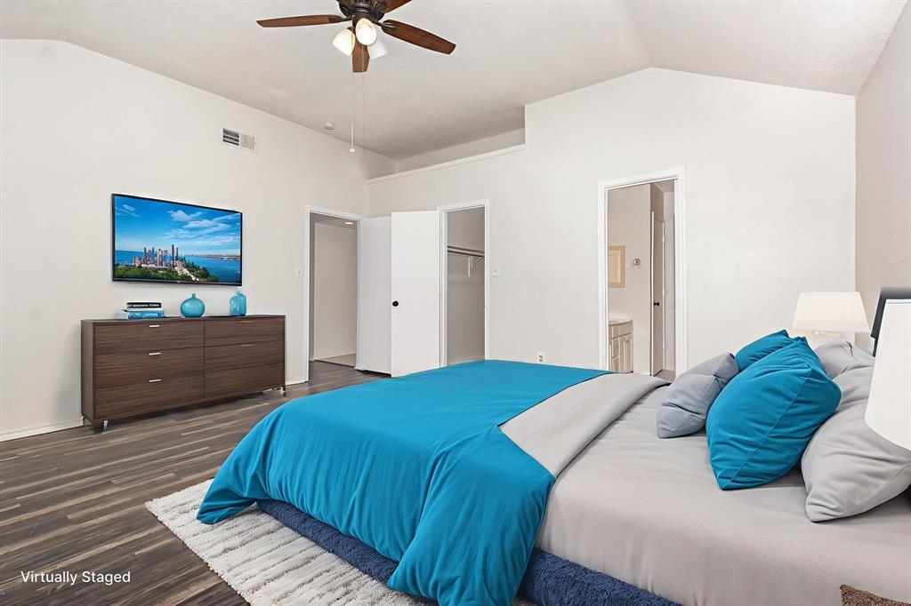 1046 Colony Street Flower Mound, TX 75028 - Photo 11 of 19 a bedroom with a bed and a television