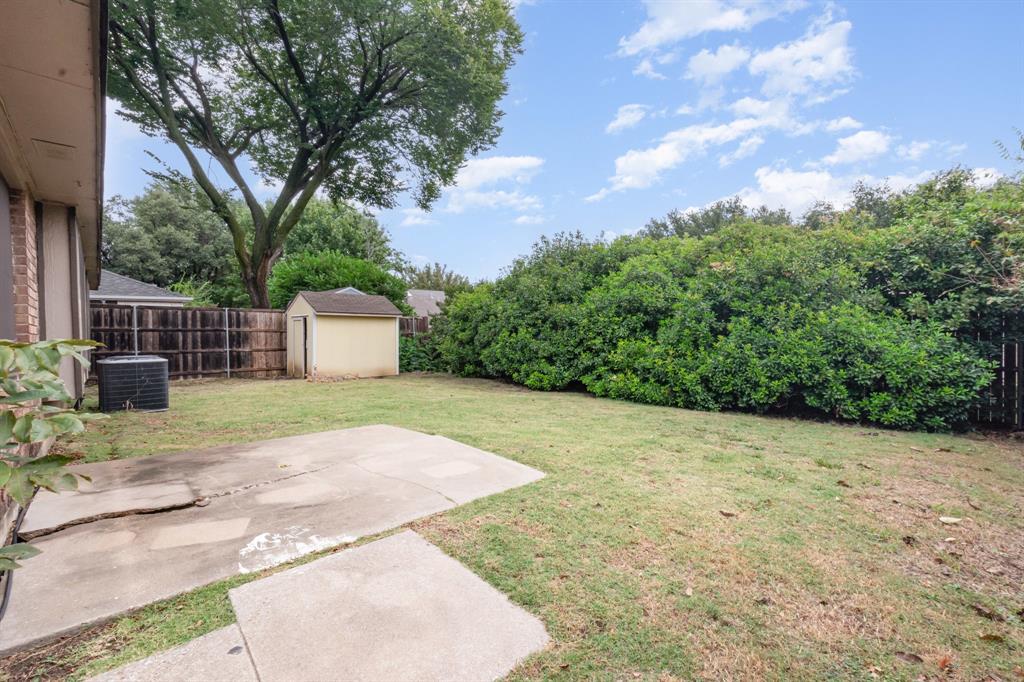 1046 Colony Street Flower Mound, TX 75028 - Photo 18 of 19 a backyard of a house with lots of green space