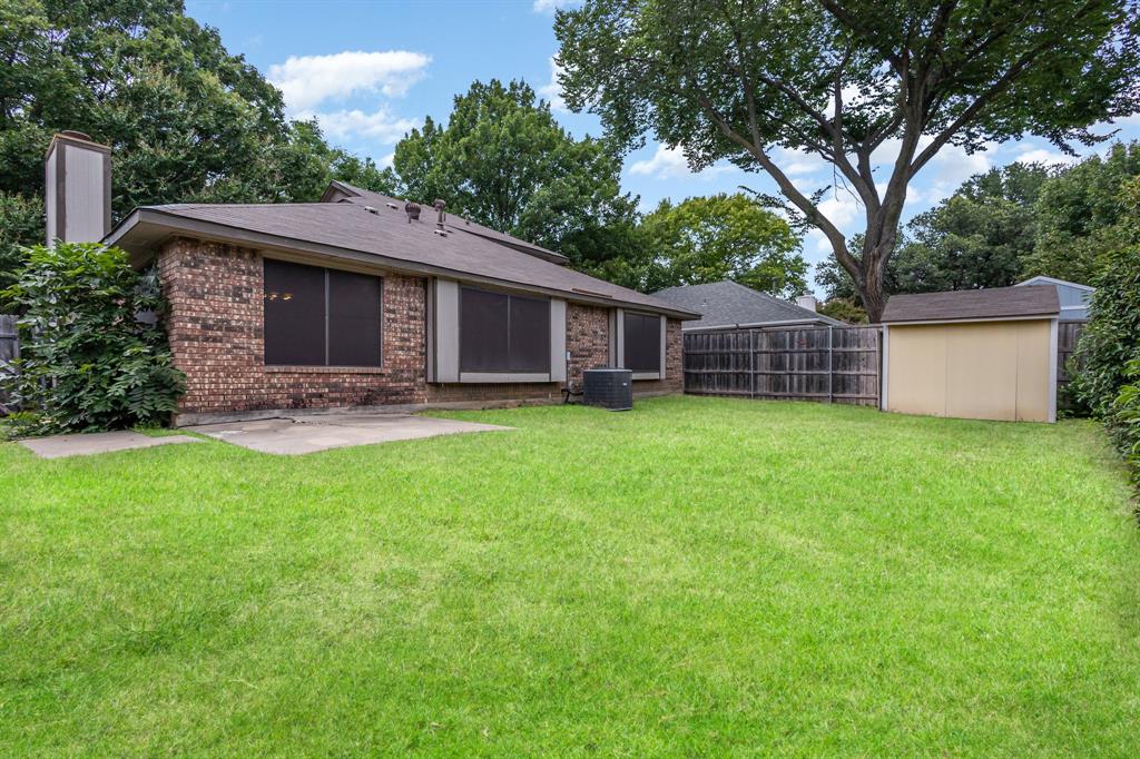 1046 Colony Street Flower Mound, TX 75028 - Photo 21 of 21 a view of a house with a yard and sitting area
