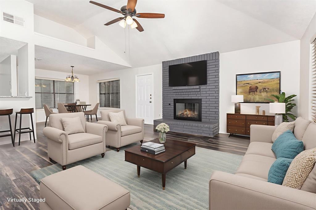 1046 Colony Street Flower Mound, TX 75028 - Photo 3 of 19 a living room with furniture and a fireplace