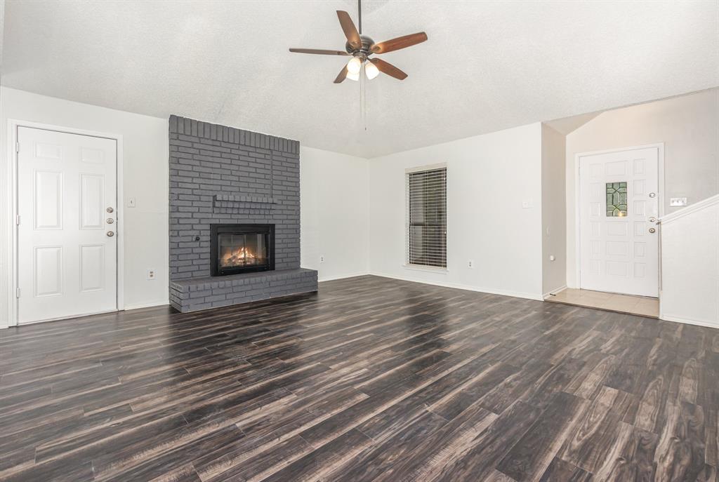 1046 Colony Street Flower Mound, TX 75028 - Photo 5 of 21 wooden floor fireplace and natural light in room