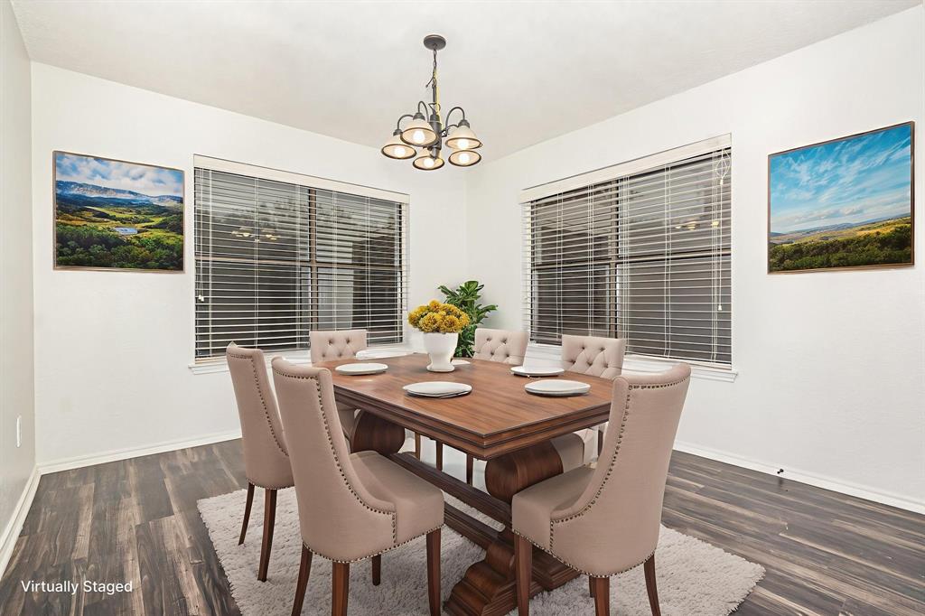 1046 Colony Street Flower Mound, TX 75028 - Photo 6 of 21 a view of a dining room with furniture window and wooden floor