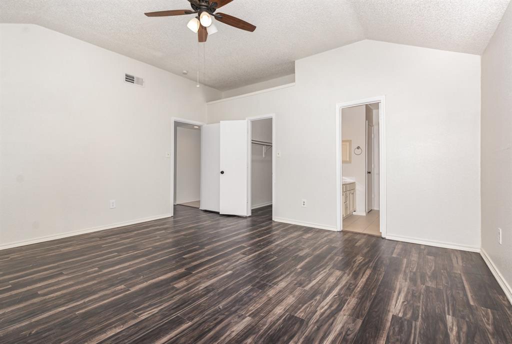 1046 Colony Street Flower Mound, TX 75028 - Photo 10 of 19 a view of an empty room with wooden floor