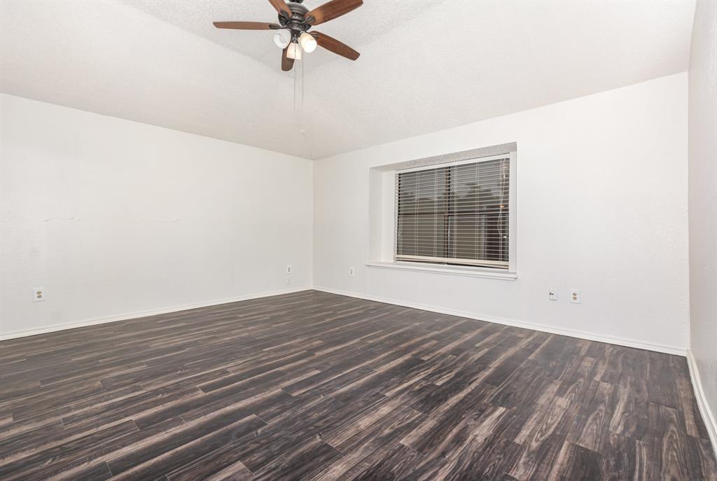 1046 Colony Street Flower Mound, TX 75028 - Photo 10 of 21 wooden floor in an empty room with a window