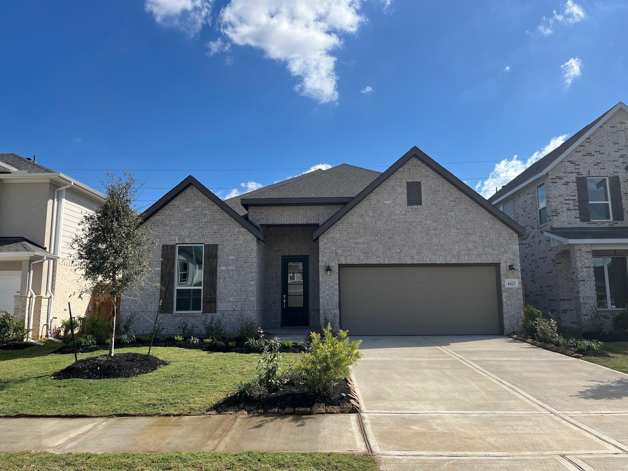 8326 Holly Blue Drive Rosharon, TX 77583 - Photo 19 of 29 a front view of a house with a yard and garage