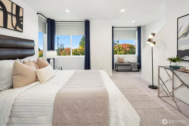 a bedroom with a bed and a couch