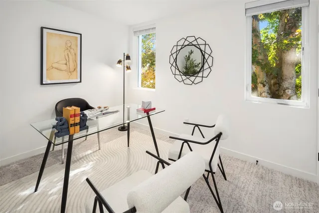 a view of a room with furniture and wooden floor