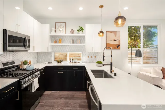 a kitchen with a sink a stove and wooden cabinets
