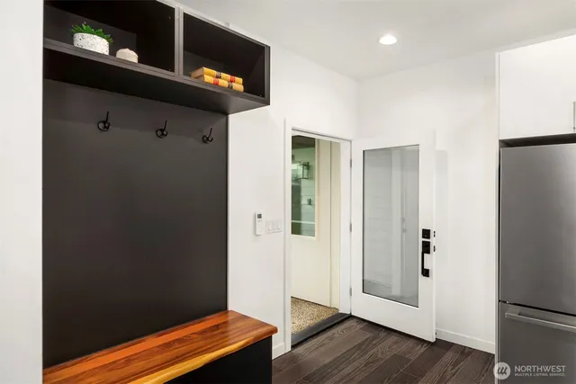 a view of an entryway with wooden floor