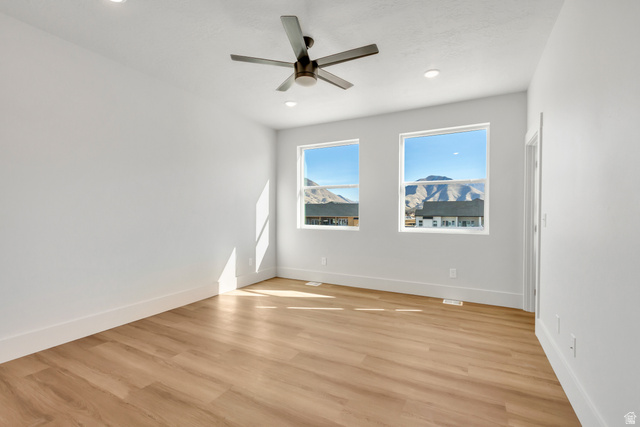 547 North Hvn Drive Mapleton, UT 84664 - Photo 13 of 23 Unfurnished room featuring light wood-type flooring, a ceiling fan, and recessed lighting