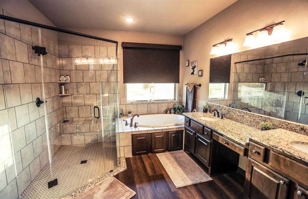 667 Comanche Lake Road Comanche, TX 76442 - Photo 11 of 26 a large kitchen with a sink and a large window