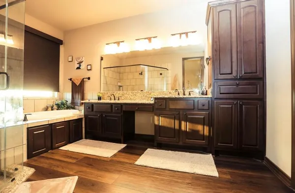 a bathroom with a sink and mirror