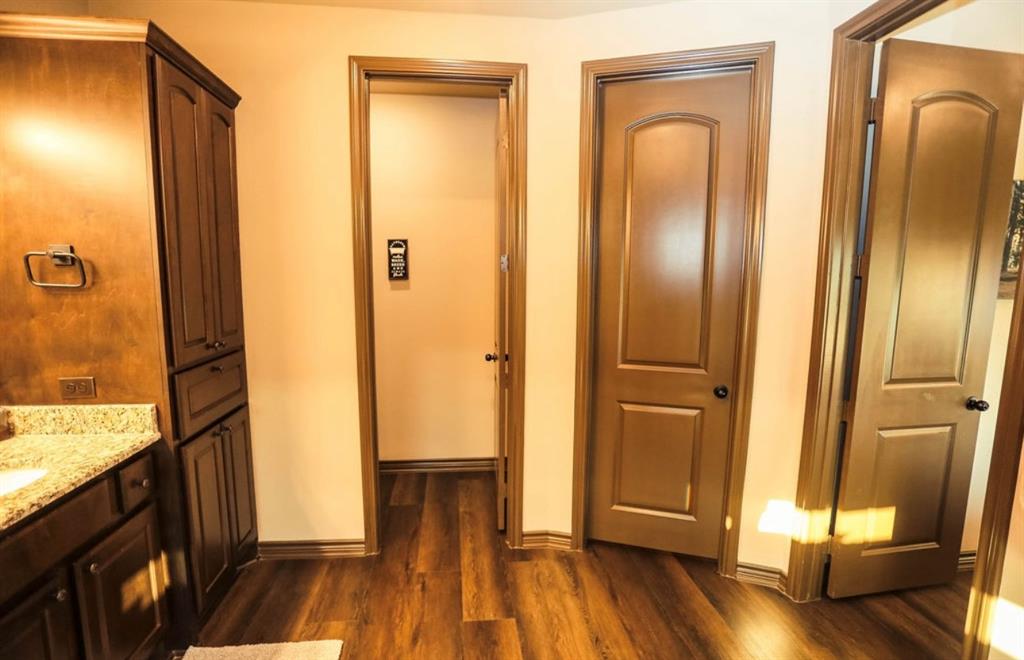 667 Comanche Lake Road Comanche, TX 76442 - Photo 16 of 26 a view of front door with wooden floor