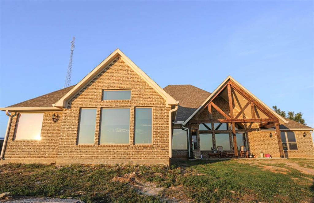 667 Comanche Lake Road Comanche, TX 76442 - Photo 26 of 26 front view of a house with a yard