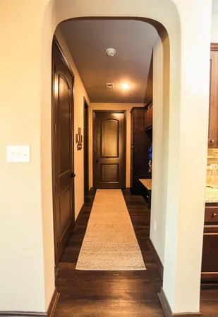 a large kitchen with a sink and a large window