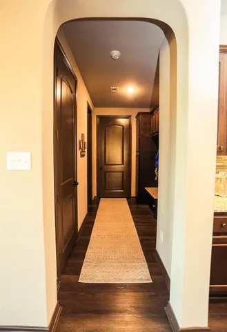 a large kitchen with a sink and a large window