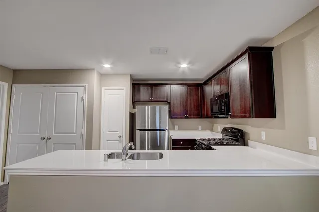a view of kitchen with stainless steel appliances
