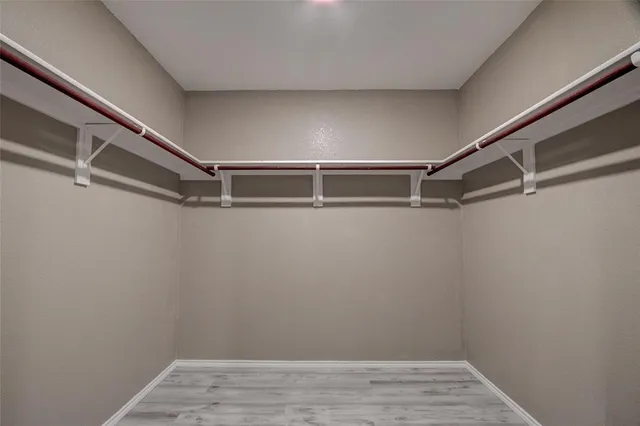 a view of an empty walk in closet