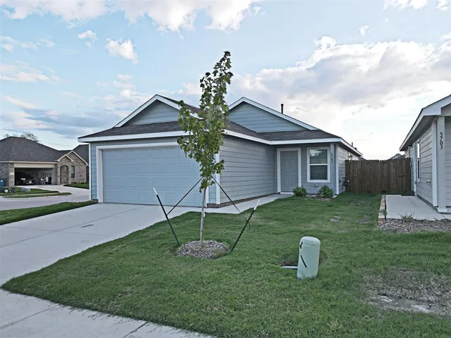 a house view with a garden space