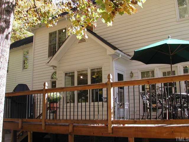 4412 Queenstown Court Raleigh, NC 27612 - Photo 11 of 11 a front view of a house with a balcony