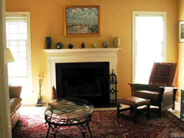 4412 Queenstown Court Raleigh, NC 27612 - Photo 5 of 11 a living room with furniture and a fireplace