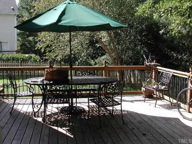 4412 Queenstown Court Raleigh, NC 27612 - Photo 6 of 11 a view of balcony with furniture and wooden deck