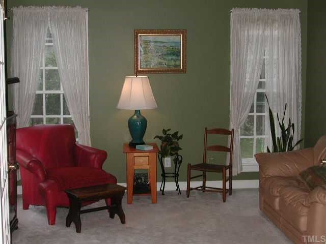 4412 Queenstown Court Raleigh, NC 27612 - Photo 8 of 11 a living room with furniture and a window