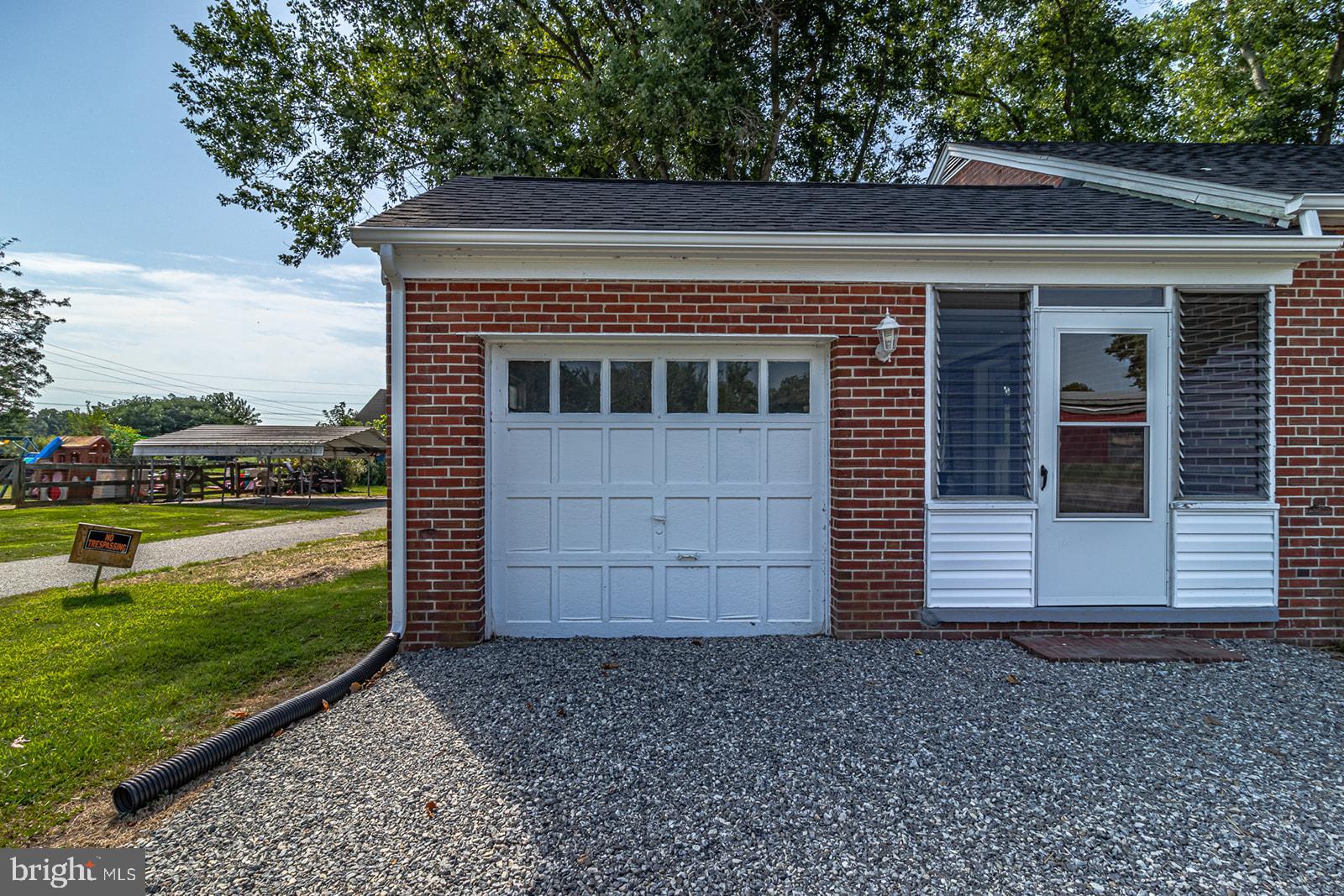 52 Lake Road Lottsburg, VA 22511 - Photo 28 of 42 One car garage, with parking in front of breezeway