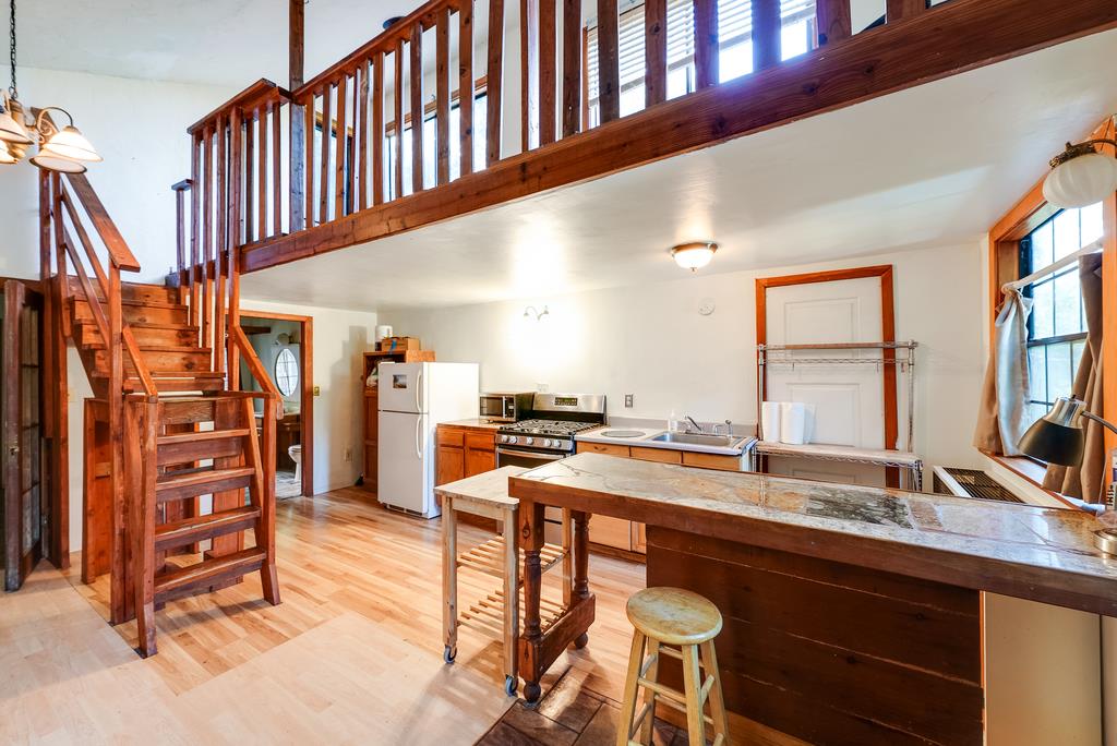400 Red Hawk Lane Aptos, CA 95003 - Photo 3 of 9 a kitchen with stainless steel appliances kitchen island granite countertop a sink and cabinets