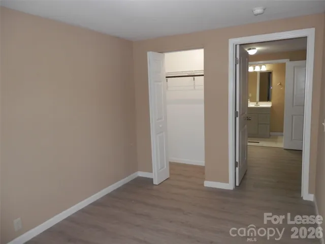 a bathroom with a sink toilet and a mirror