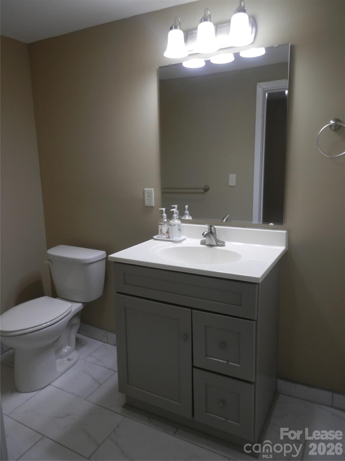 67 Barber Street Northwest Concord, NC 28027 - Photo 15 of 27 a bathroom with a sink toilet and a mirror